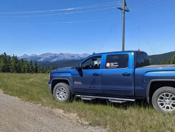 Western Line Locators truck on a foothills road in Alberta